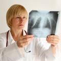 Woman doctor viewing xray